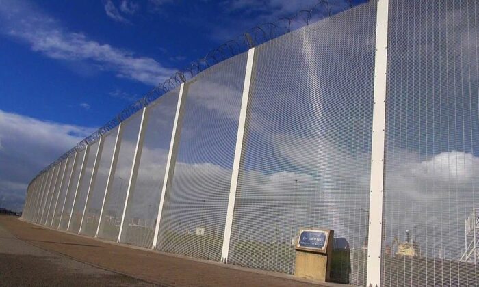 Calais jungle fence voa photo