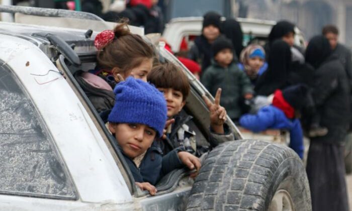 Children Sit In A Car As They Wait To Be Evacuated From A Rebel Held Sector Of Eastern Aleppo