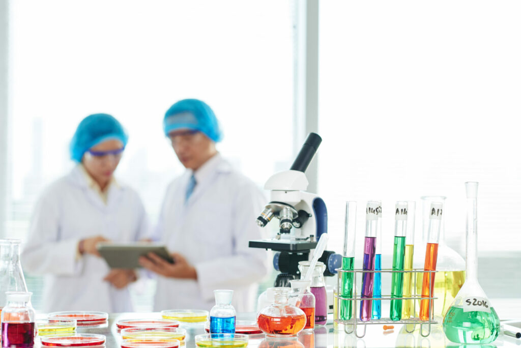 Laboratory glassware and microscope