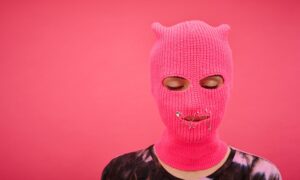 Woman In Pink Mask On Pink Studio resized